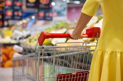 Woman shopping for groceries in supermarket