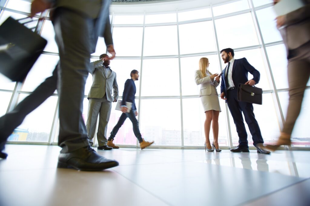 businesspeople-walking-through-office